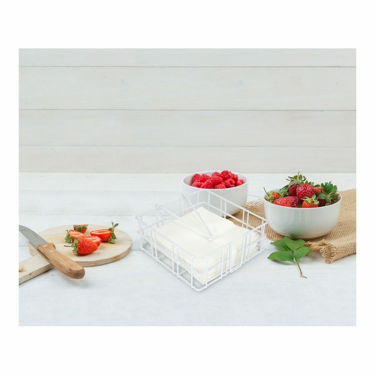 Strawberry and raspberry on cutting board with leaves,knife side view, on piece of sack and wooden background S2230898_3