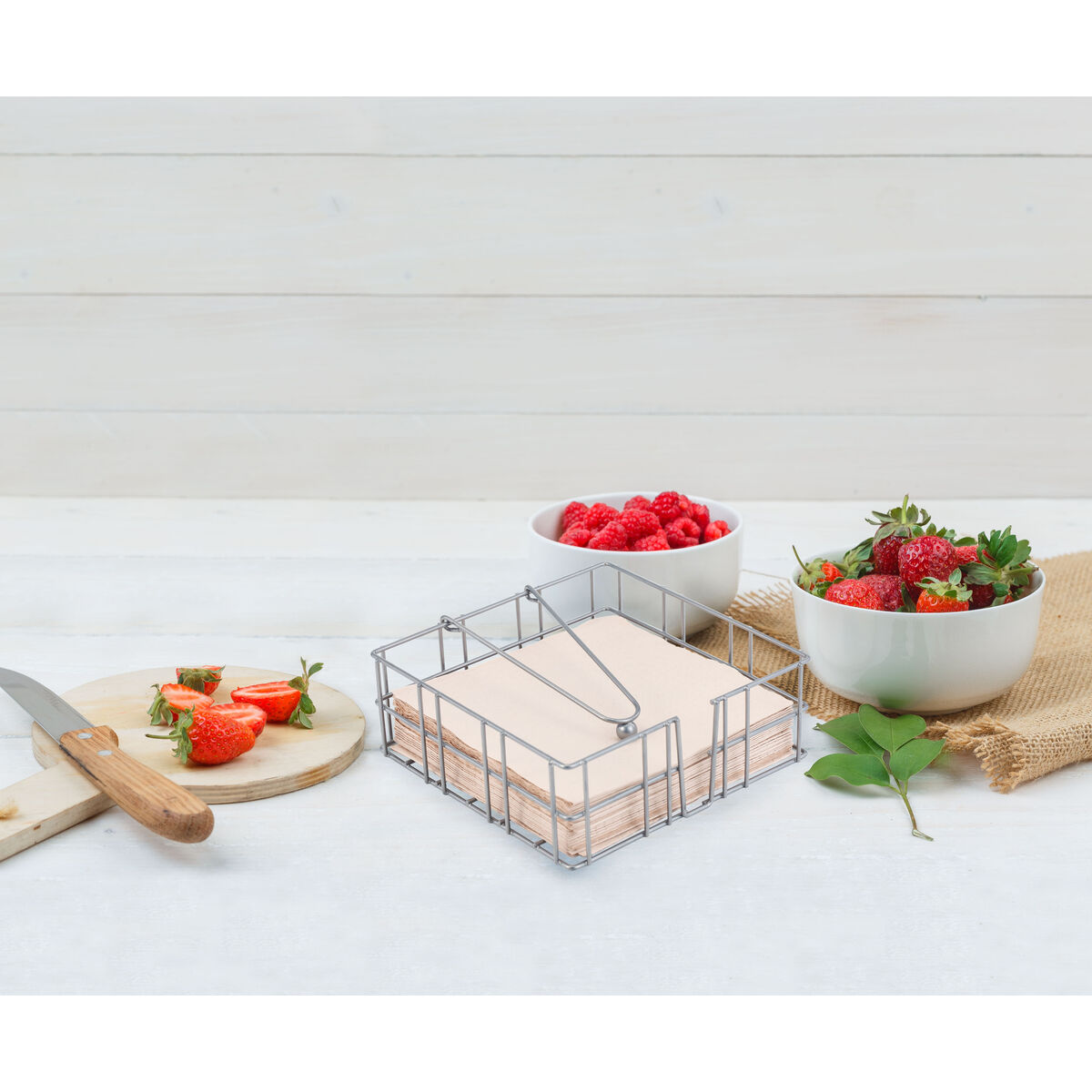 Strawberry and raspberry on cutting board with leaves,knife side view, on piece of sack and wooden background S2235821_4